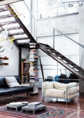 a gorgeous aged metal staircase makes a statement, metal furniture echoes with it and adds to the space