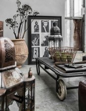 an oversized metal and wood coffee table on large wheels instantly adds an industrial feel to the space