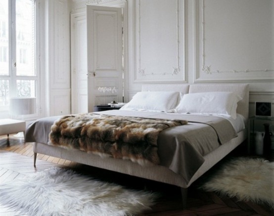 Thing about adding a fur rug. It add coziness, comfort and manly look.