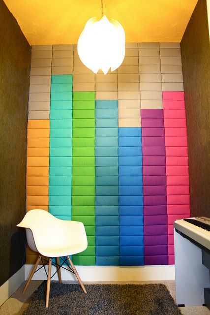 super colorful soundproofing panels on the wall imitate the sound   ideal for a musical room