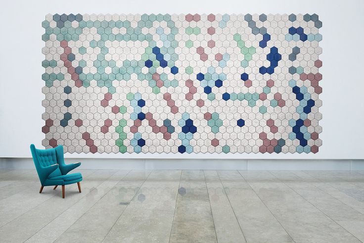 colorful hex acoustic panels arranged in a large artwork look very bold and chic