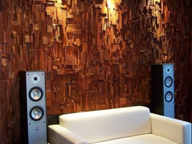 a wood covered wall is a bold statement and a chic idea for decor and soundproofing