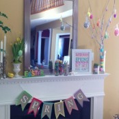 an Easter tree with colorful eggs, a bright bunting, daffodils in a pot, colorful letters and bright candies in a jar