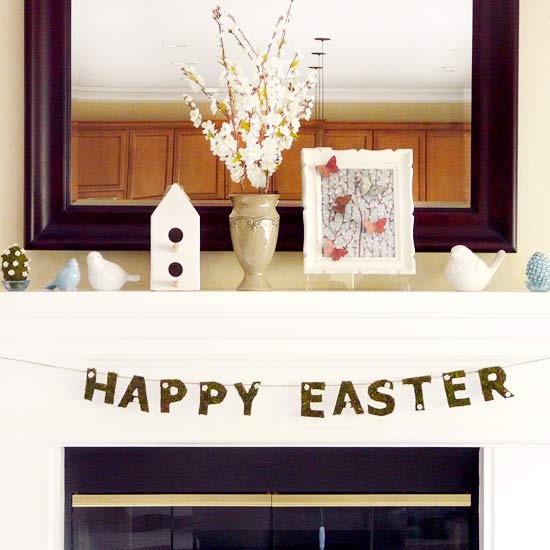 an Easter bunting, birdies and some faux eggs plus blooming branches in a vase