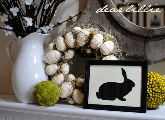 vintage styling with a fake Easter egg wreath, moss and berry balls and bloomign branches