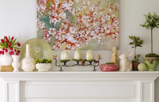 a sweet pastel Easter mantel with fake eggs and bunnies, some greenery and tulips
