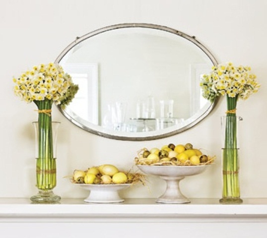 simple and elegant Easter mantel styling with neutral spring blooms and faux eggs in bowls