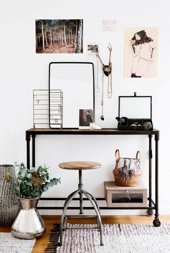 an industrial desk made of metal pipes and a wooden desktop is a stylish idea not only for an industrial space