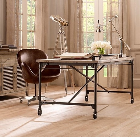 a metal desk of pipes, wood and casters, a brown leather chair and some metal table lamps for a lovely and cool look