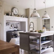 white tiles around the cooker are imitating the bricks and look bold and catchy, besides they are easy to clean