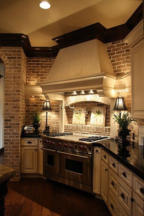 a brick statement wall adds interest to the traditional kitchen done in neutrals and brings texture