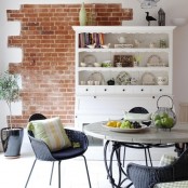 a piece of red brick in the dining zone for more eye-catchiness and a bolder look of the space