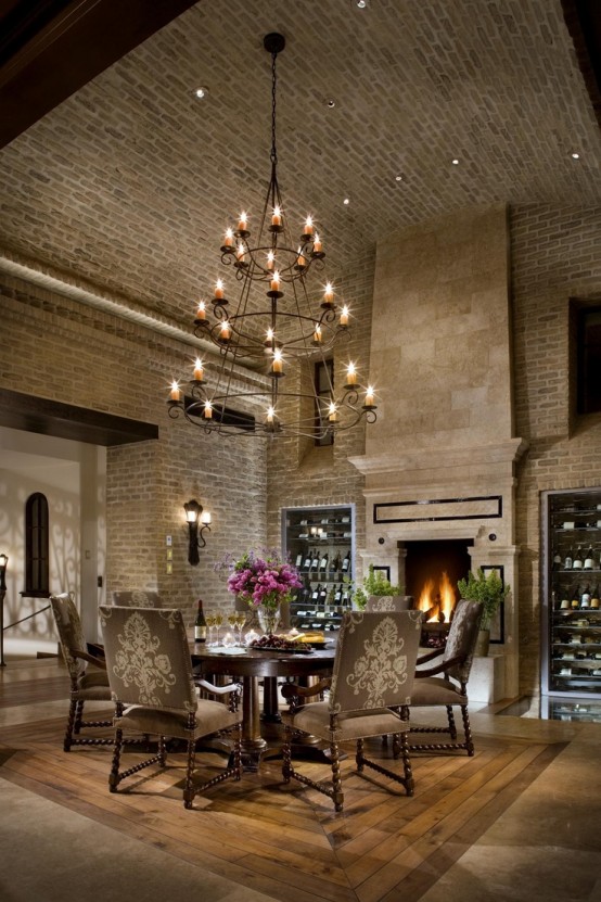 a formal vintage dining room with original brick walls and an arched ceiling looks very elegant and refined