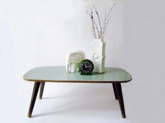 a chic coffee table with dark stained legs and a mint-colored tabletop is a cool idea for adding a bit of color to the space