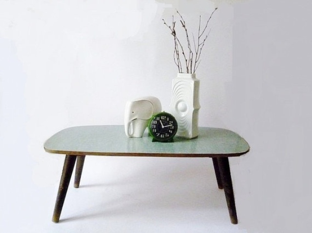 a chic coffee table with dark stained legs and a mint colored tabletop is a cool idea for adding a bit of color to the space