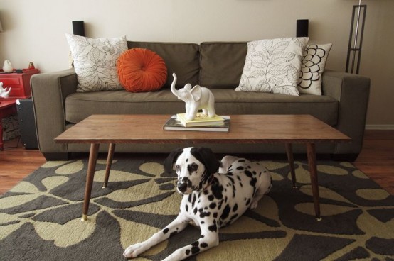 a classic rich-stained coffee table with tapered legs is a cool and timeless addition to a mid-century modern or Scandinavian space