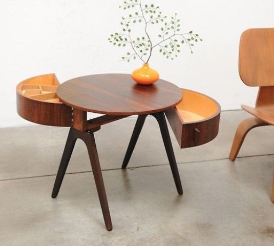 a creative round rich stained mid century modern coffee table on tall legs and with semi circle drawers is a very stylish idea