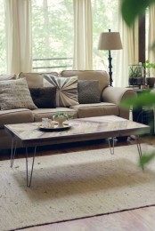 a timeless coffee table with a chevron tabletop and hairpin legs is a cool idea that will add a bit of pattern to the space