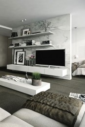 a modern floating TV unit in white, some shelves and a white coffee table with a storage space for effective storing