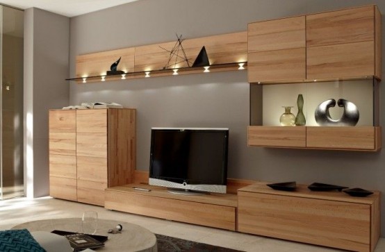 a group of light-stained sleek storage units - wall-mounted and floor ones composing a stylish system on the wall