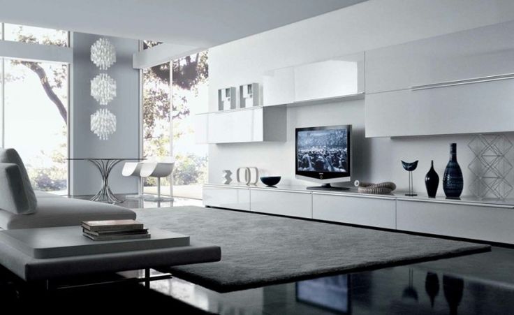 a sleek minimalist white storage system of closed glossy compartments on the wall and floor