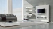 a minimalist white storage system of a wall with a niche and some floating shelves is a very cool idea