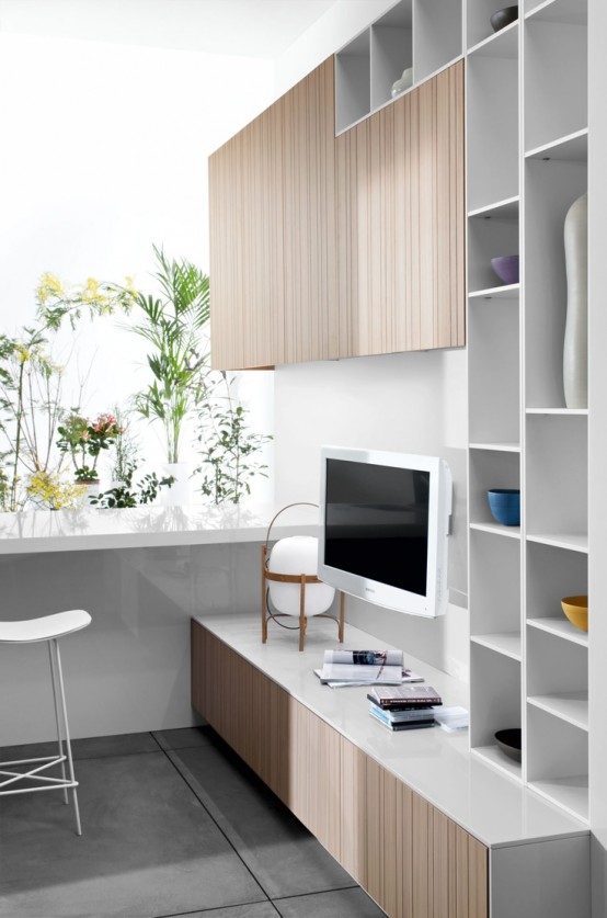 a storage system of white and light stained compartments, open and closed ones, is a lovely idea for a modern or Scandinavian space