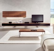 a storage system of rich stain and black, two units – on the wall and floor looks veyr minimalist and very chic