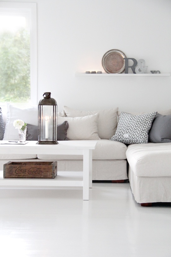 a cozy scandi living room design with a sectional sofa