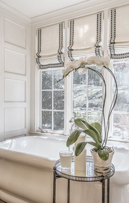 striped Roman shades perfectly fit a beautiful and elegant bathroom match the style and the look of the space