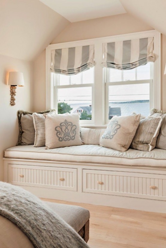 grey and white striped Roman shades accent the room and block out the sun very well if needed, they match the style of the room