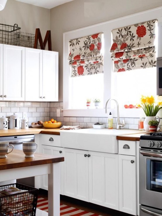 bright floral print Roman shades add color and print to the kitchen and match the decor very chic and very cool