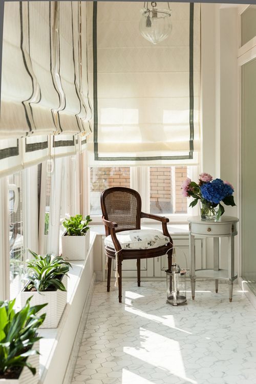 white and grey Roman shades make this balcony extremely elegant and chic and add a sophisticated touch blocking out the sun