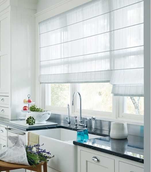 neutral striped Roman shade adds coziness to the kitchen and perfectly matches the farmhouse spaces at the same time