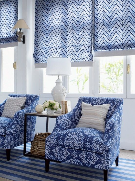 blue chevron print Roman shades add color and print to the living room and make the space very welcoming