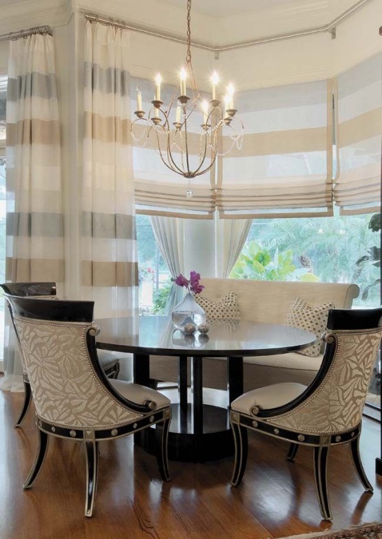 striped Roman shades and matching curtains are great to make the dining space welcoming, cozy and private when needed