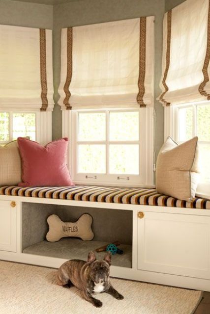 white and brown striped Roman shades styling the bay window look cool and chic and add a private feel to this nook