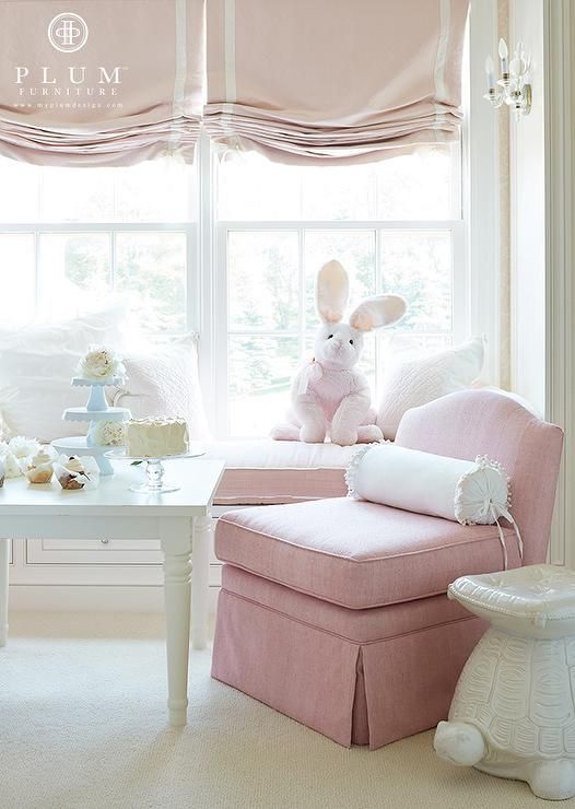 lovely pink and white Roman shades are a beautiful and delicate window treatment for a little girl's room and they add elegance