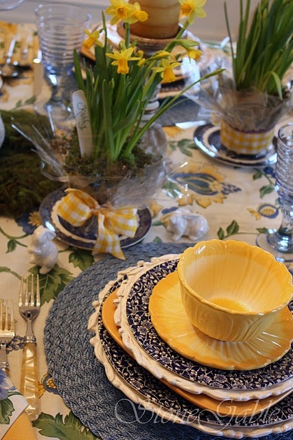 a bright navy and yellow place setting with various patterns