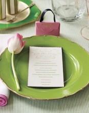 a green and pink spring place setting with a tulip