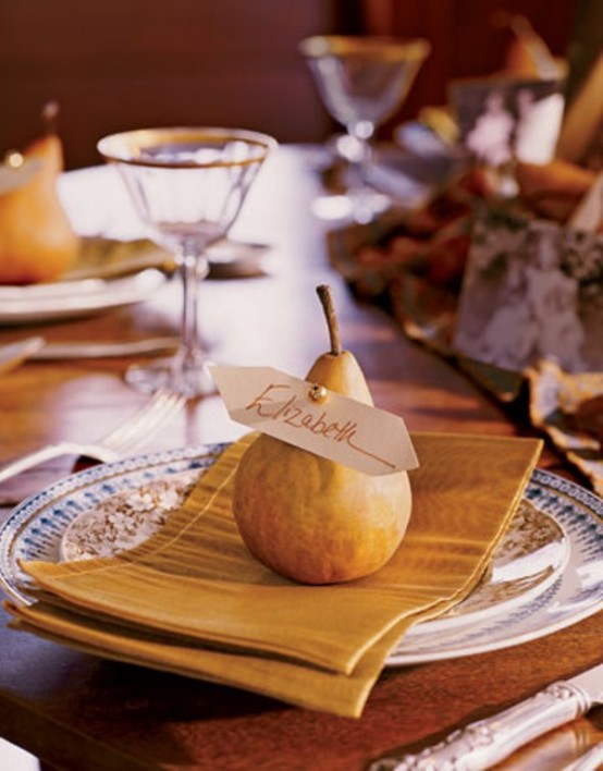 beautiful vintage printed plates and a mustard napkin plus a pear for a lovely and cool Thanksgiving place setting