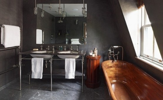 A wooden bathtub could be a great solution to add some warmness to pure black bathroom.