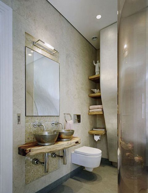Metal sinks and rough wood floating shelves add a manly touch to this contemporary bathroom.