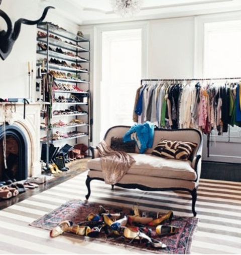 If you have a whole room for your clothes an open storage solutions are perfect then. Wall shelves and coat racks would keep everything on hand.