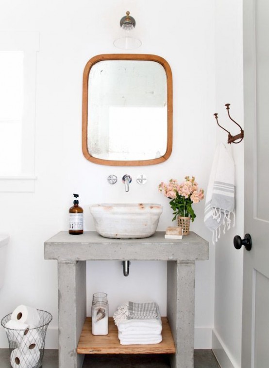 a concrete vanity with a matching sink is a stylish solution for a modern bathroom and it will be super durable and bold