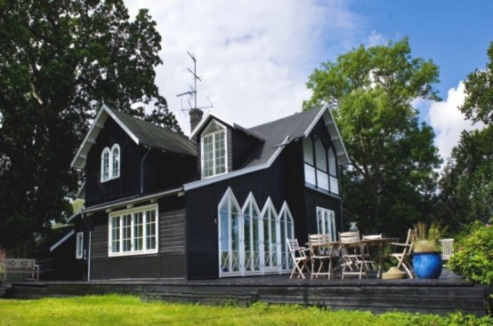 Summer House Decorated With Rough Wooden Furniture