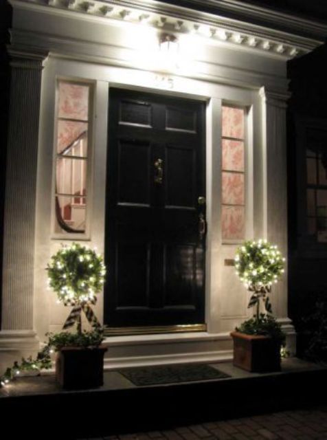 potted topiaries with lights will light up the entrance or your porch and make your space super welcoming
