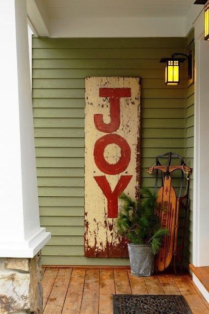 a shabby chic Christmas sign in red and white is a stylish way to decorate your outdoor space and you can make it of some old materials