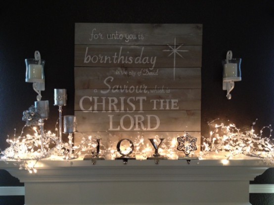 a simple rustic, non-painted woodne plaque Christmas sign paired with lights and letters are a lovely decor idea for the holidays