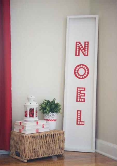 a simple and laconic red and white Christmas sign with letters is a lovely decor idea for the holidays